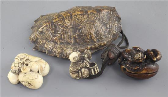 Two Japanese ivory netsuke and a turtle carapace pouch and netsuke, 19th century, carapace 10.7cm (3)